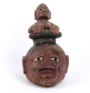 A PAINTED WOOD HELMET MASK Yoruba 27 cm high Provenance:...