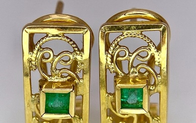 A Pair of 18K Yellow Gold and Emerald Earrings. Clip clasp w...
