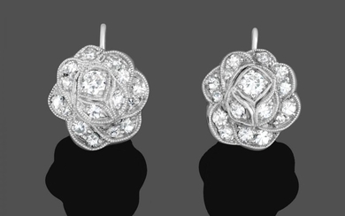 A Pair of Diamond Cluster Earrings, the floral motifs set...