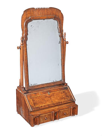 A Queen Anne walnut dressing table bureau and mirror