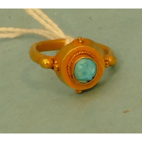 A Roman High Carat Gold Ring set with turquoise, 3.9g gross.