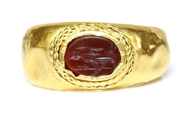 A Roman gentlemen's high carat gold cornelian intaglio ring