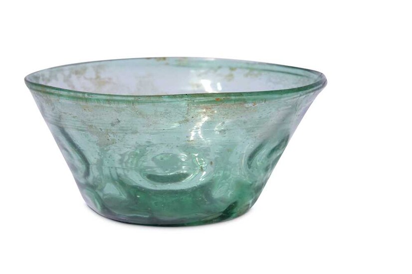 * A SMALL GREEN MOULD-BLOWN CLEAR-GLASS BOWL Iran, 10th - 12th century