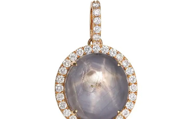 A STAR SAPPHIRE AND DIAMOND PENDANT set with a rou ...
