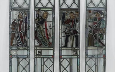 A Set of Four Stained Glass Windows.