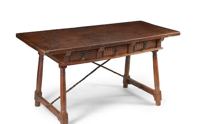 A Spanish baroque walnut three drawer table