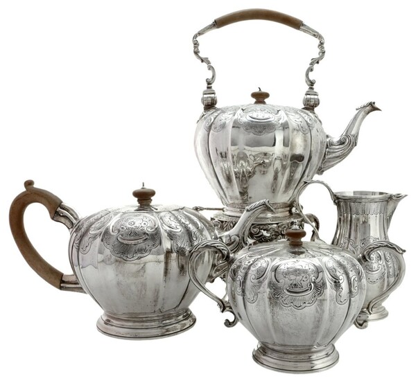 A Splendid Five Piece Silver Tea Service Including a tea kettle with spirt burner, pumpkin sha...