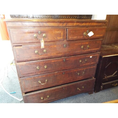 A Victorian military style oak chest of two short over four ...