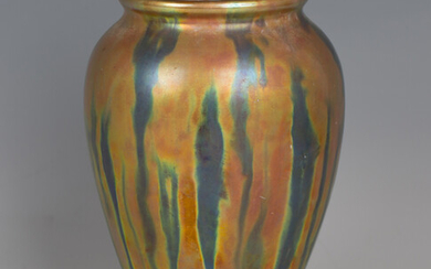 A Zsolnay Pécs lustre vase, the ovoid body covered in a green and orangey yellow iridescent gla