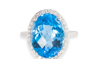 A blue topaz, diamond and fourteen karat white gold ring