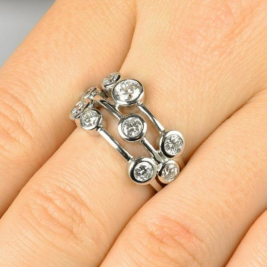 A brilliant-cut diamond collet dress ring. Total
