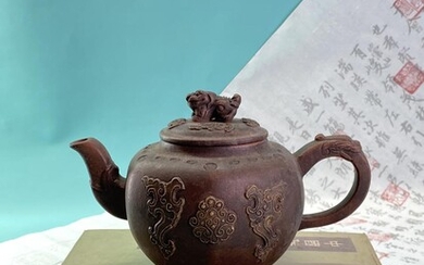 A carved Chinese teapot possibly “YiXing” 宜兴 with “Qilin”...