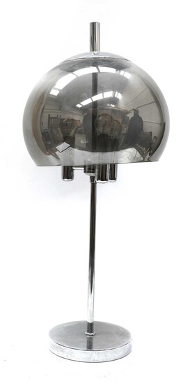 A chrome table lamp