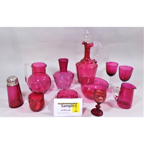 A collection of 19th century cranberry glass wares comprisin...