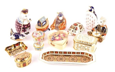A collection of Royal Crown Derby paperweights, comprising a drummer bear, a honey bear, a wren, and