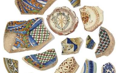 A collection of fourteen Italian Maiolica and incised slipware fragments, 14th - 16th century, comprising: A Castel Durante or Urbino fragment of a ‘bella donna’ dish, circa 1520-30, painted with a lady’s ear and neck and part of the identifying...