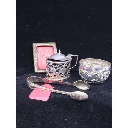 A collection of silverware, including, a small photo frame, ...