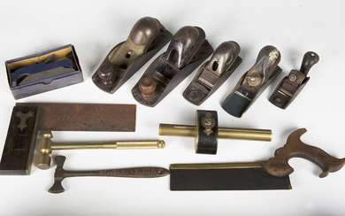A collection of woodworking tools, including two Stanley planes, numbers 140 and 110, a Record 0702