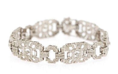 NOT SOLD. A diamond bracelet set with numerous baguette and brilliant-cut diamonds weighing a total...