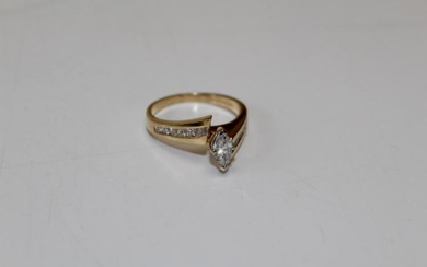 A diamond marquise solitaire ring, the principal stone an estimated...