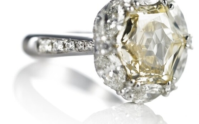 NOT SOLD. A diamond ring set with a hexagonal-cut diamond weighing app. 5.01 ct. encircled...