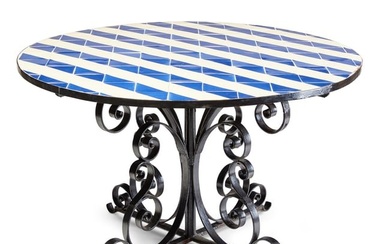 A glazed tile inset ebonized iron garden table