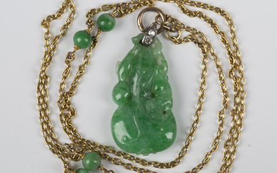 A gold, jade and diamond pendant necklace, the jade pendant carved and pierced as a gourd, with a di