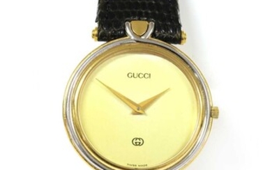 A gold plated Gucci quartz strap watch
