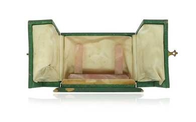 A green leather watch case by Cartier, containing...