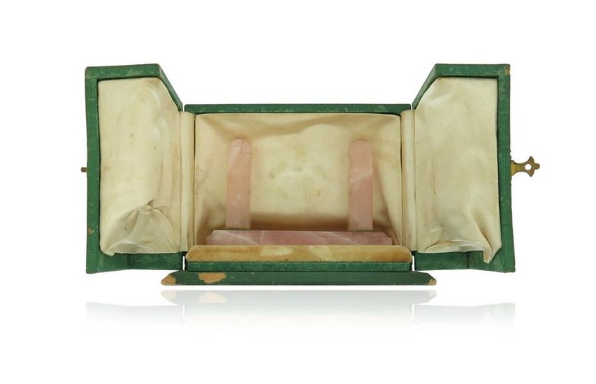 A green leather watch case by Cartier, containing...