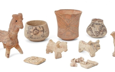 A group of Proto-Indus valley animal figures, comprising a three slip-painted vessels, a model of a ram, two sheep, a bird, and two rectangular carved bone buttons (one fragmentary), ram 9.7cm. high (9) Provenance: Private London Collection formed...