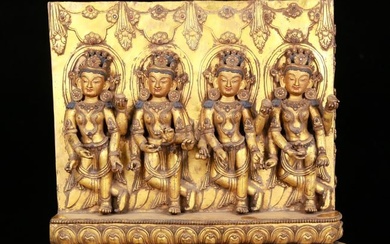 A huge gilt bronze statue of the four-armed Avalokitesvara inlaid with gems