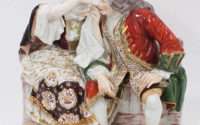 A large 19th century continental porcelain group showing a couple...