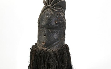 A large African tribal wood and rope mask