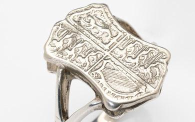 A large and heavy sterling silver heraldic shield ring, the...