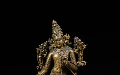 A large copper and silver-inlaid figure of Avalokiteshvara, Eastern India, Pala period, 12th century