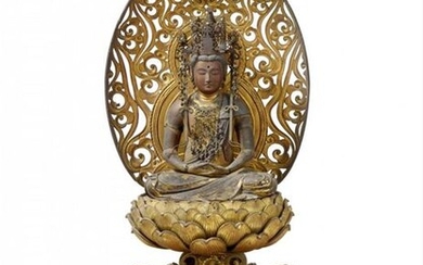 A large lacquered and gilded wood figure of Miroku Bosatsu....