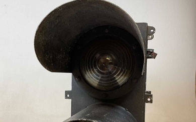 A large railway double light with stepped lenses and hood...