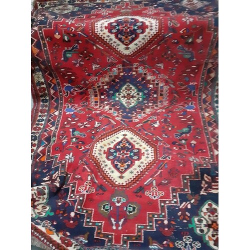 A large red ground Tabriz carpet, 200cm x 120cm Condition: t...