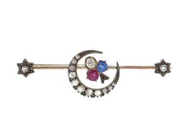 A late Victorian gold and silver, ruby, sapphire and diamond shamrock crescent brooch