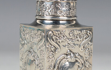 A late Victorian silver rectangular tea caddy with reeded domed cover and flower bud finial, each si