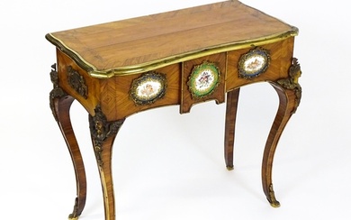 A mid 19thC kingwood side table with a brass moulding to the...