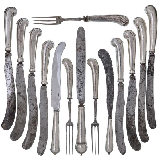 A mixed group of 18th century silver handled flatware comprising: three various knives with cannon ball handles; three three-tined forks, the handles of two with Watson clan crest; a set of four silver pistol handled knives with greyhound crest;...