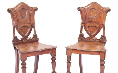 A pair Victorian mahogany hall chairs, mid 19th century; the...