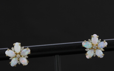 A pair of 9ct yellow gold flower shaped opal and diamond set stud earrings, L. 1.2cm.