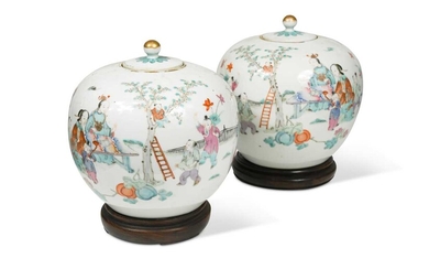 A pair of Chinese famille rose porcelain ovoid vases and covers, late Qing Dynasty