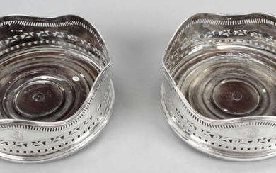 A pair of George III Irish silver mounted wine coasters.