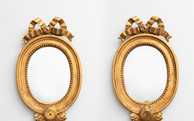 A pair of Gustavian style mirror lamps, second half of the 20th century.