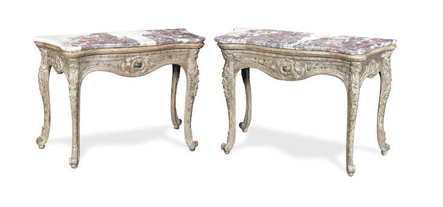 A pair of Italian silvered and painted console tables