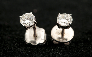 A pair of diamond stud earrings. The round brilliants each approx. 0.33cts (0.